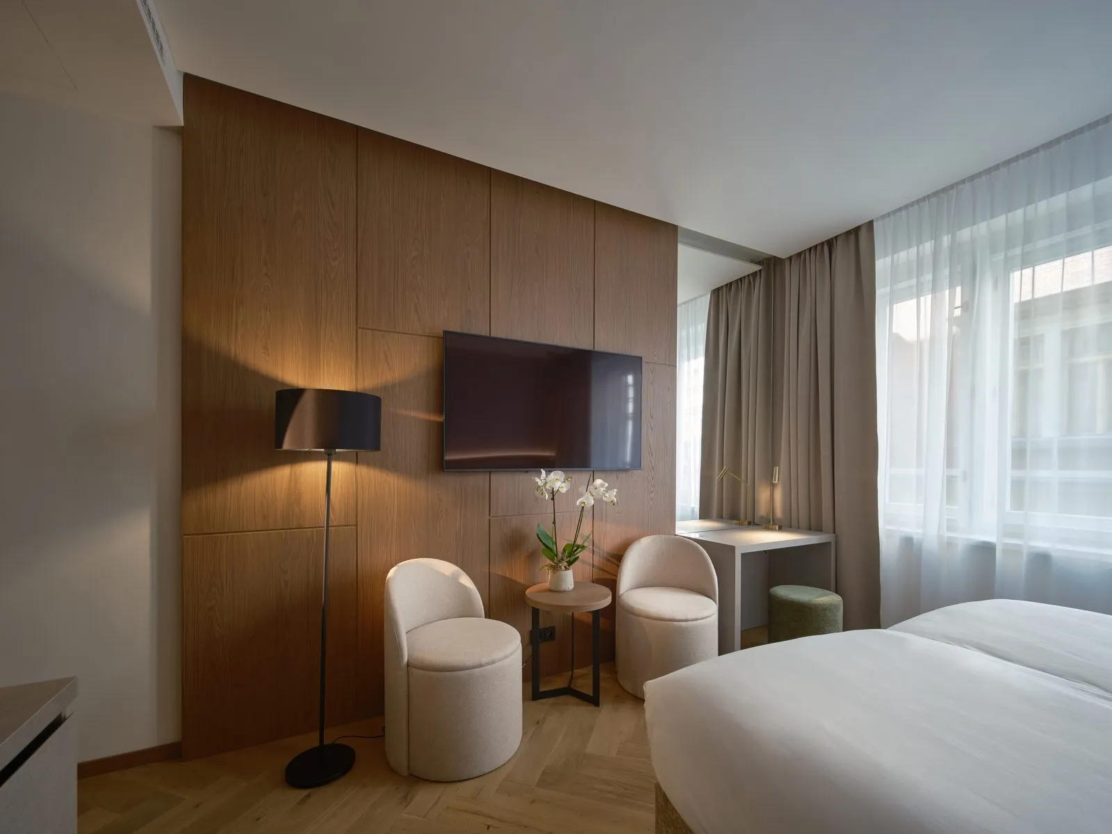Seating area in a guest room – The Benedict Boutique Hotel